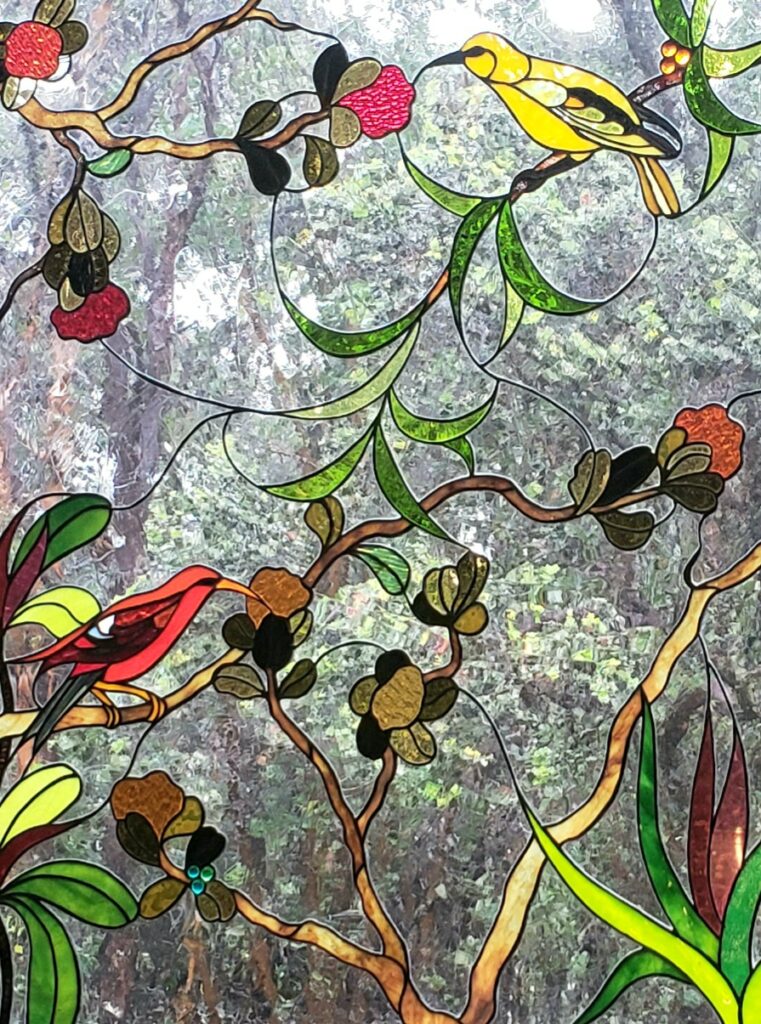 You may encounter some ‘i‘iwi and ‘amakihi birds just like the ones depicted in the stained-glass window at Tutu’s Place while wandering among the tropical flowers on the Volcano cottage grounds